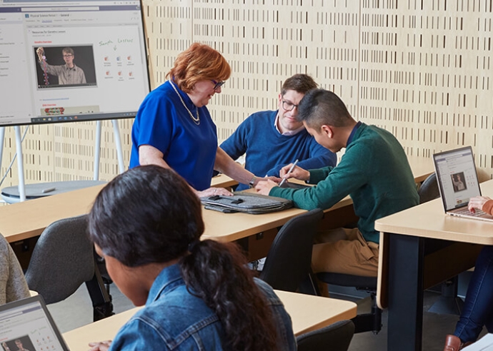 People working on Microsoft Surface Go 4