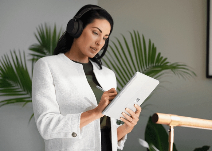 Woman using Microsoft Surface Go 4