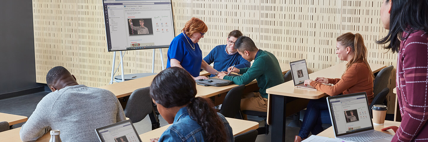 People working on Microsoft Surface Go 4