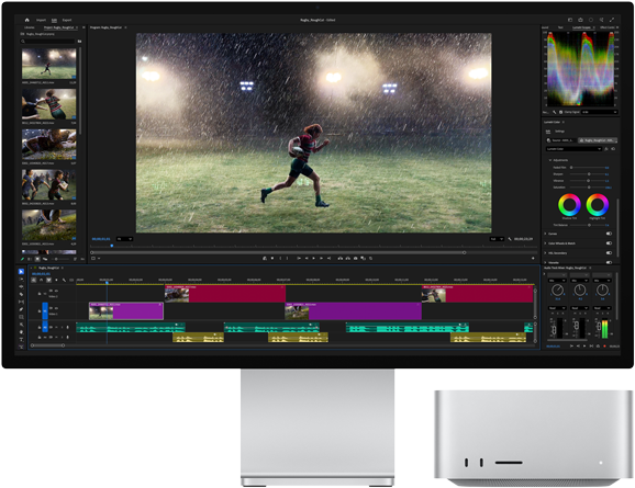 Apple Studio Display connected to a Mac Studio M5, with Adobe Premiere Pro open, showing the timeline and color correction.
