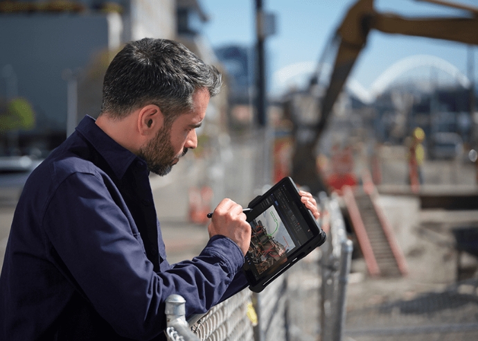 Man using Microsoft Surface Go 4