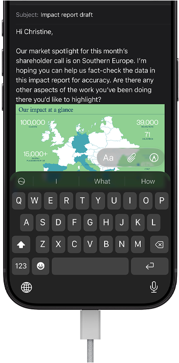 Smartphone displaying draft email requesting fact-checking with embedded map of market data in Southern Europe